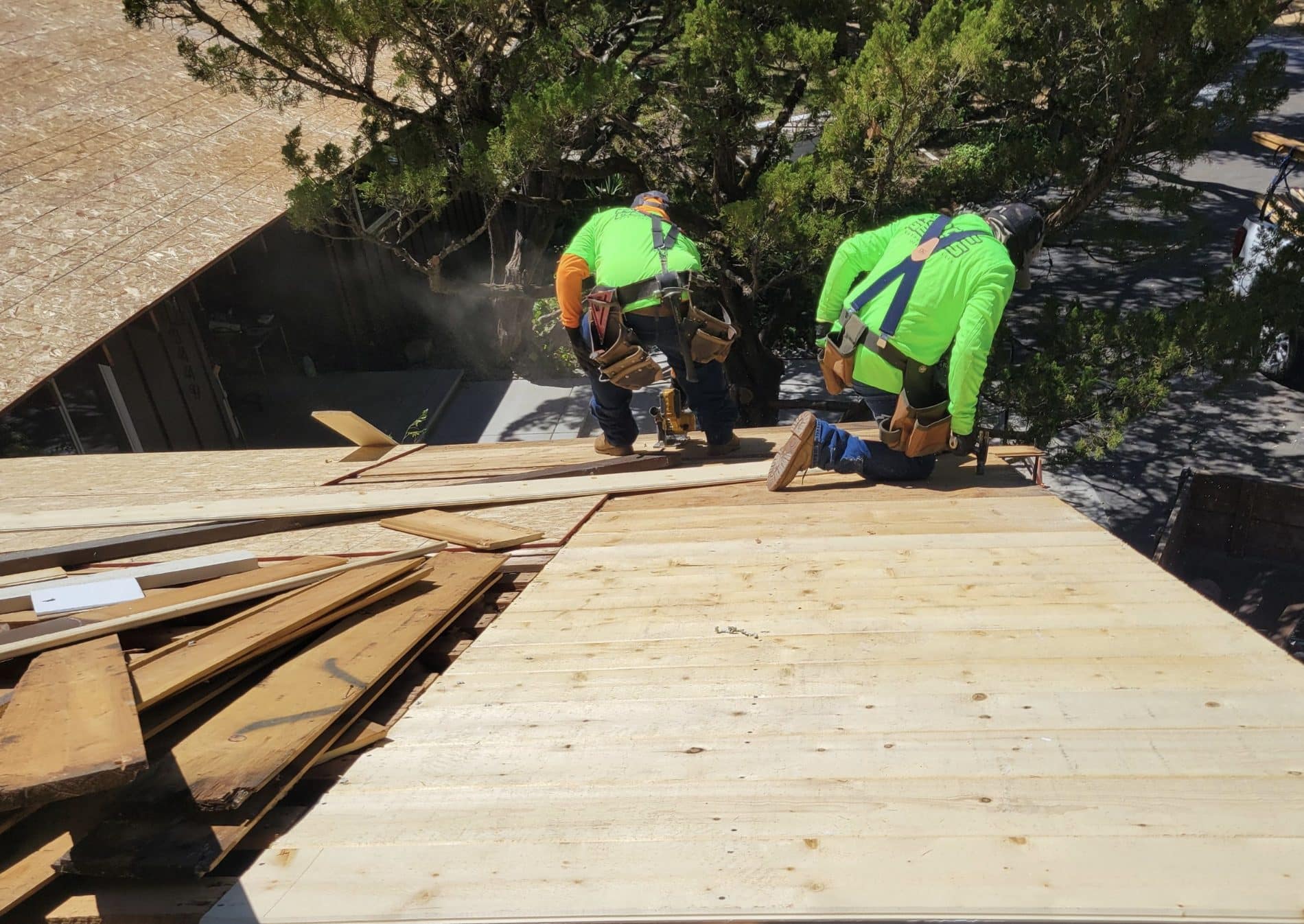 Roof Geeks crew installing roof decking