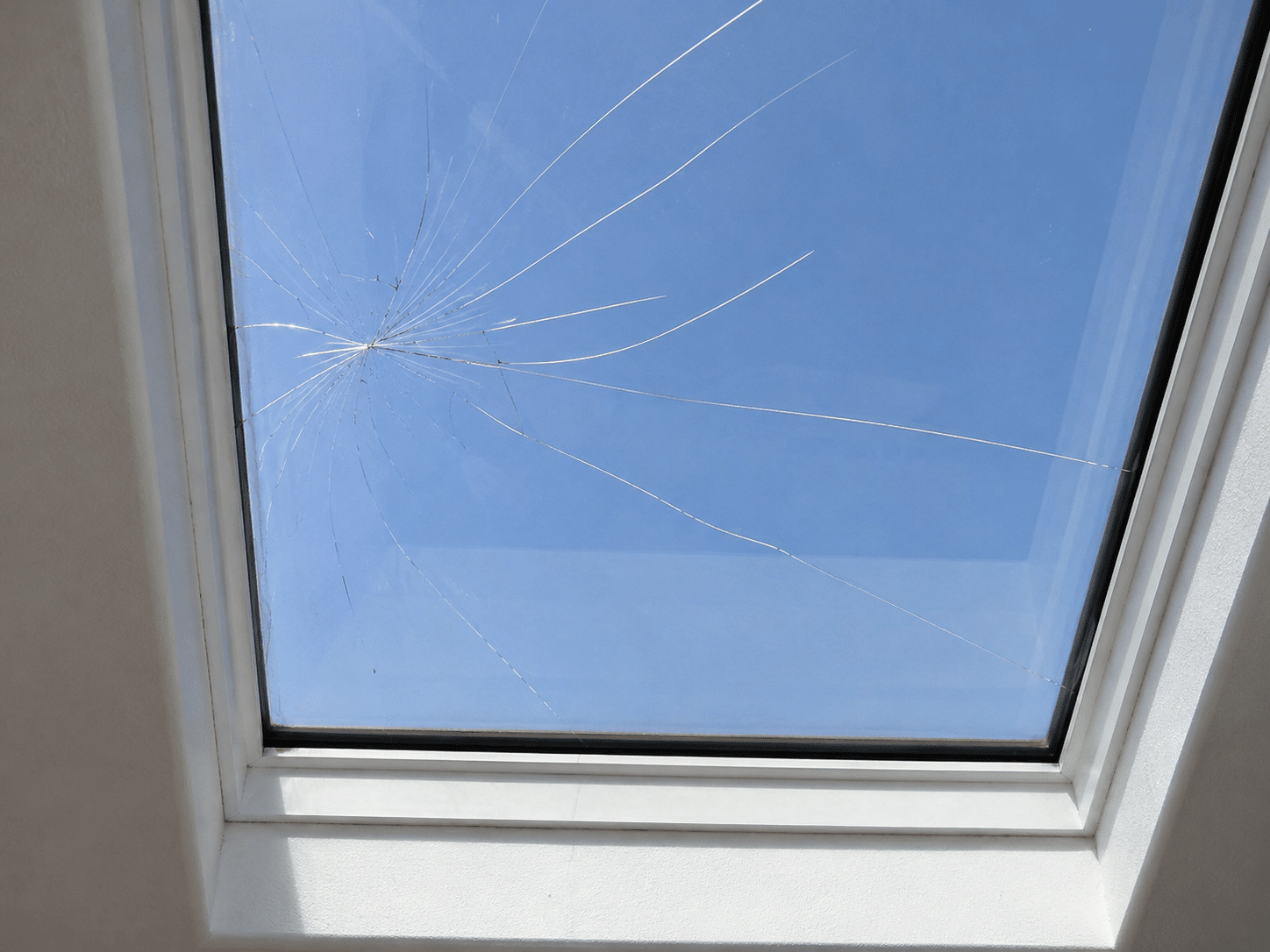 A cracked skylight during the daytime